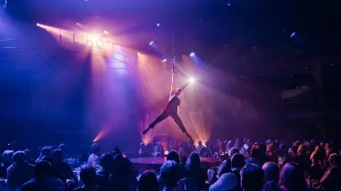 A man doing an aerial performance.